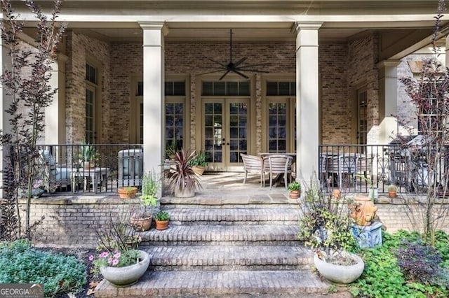 doorway to property with french doors and a porch