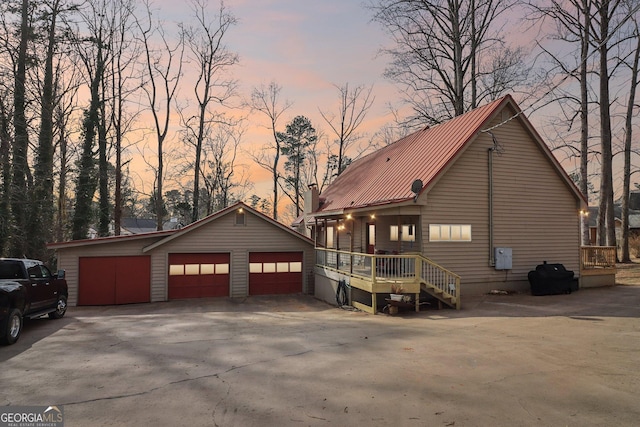 view of front facade with a garage and an outdoor structure