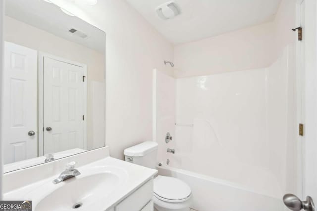 full bathroom featuring vanity, toilet, and bathing tub / shower combination