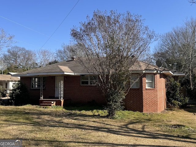 bungalow with a front yard