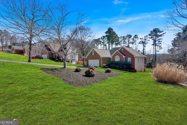 exterior space with a garage and a front lawn