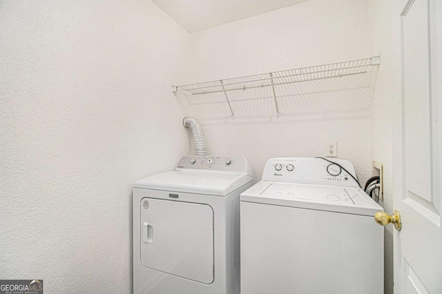 laundry area with separate washer and dryer