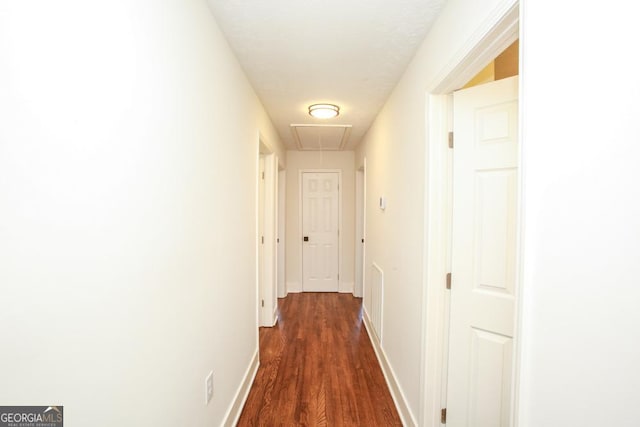 hall with dark hardwood / wood-style floors