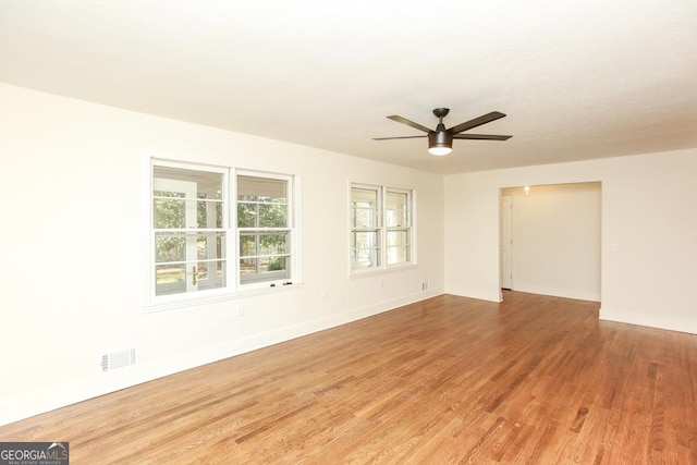 unfurnished room featuring hardwood / wood-style floors and ceiling fan