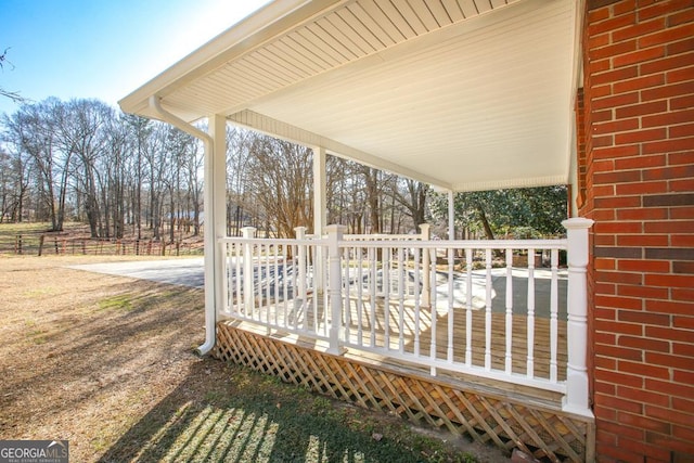 wooden deck featuring covered porch