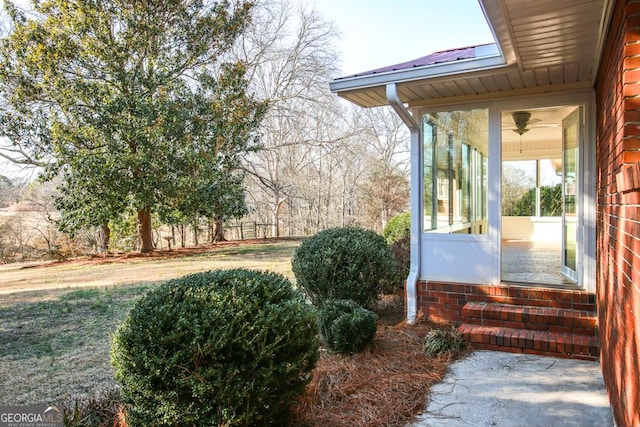 view of yard featuring a sunroom