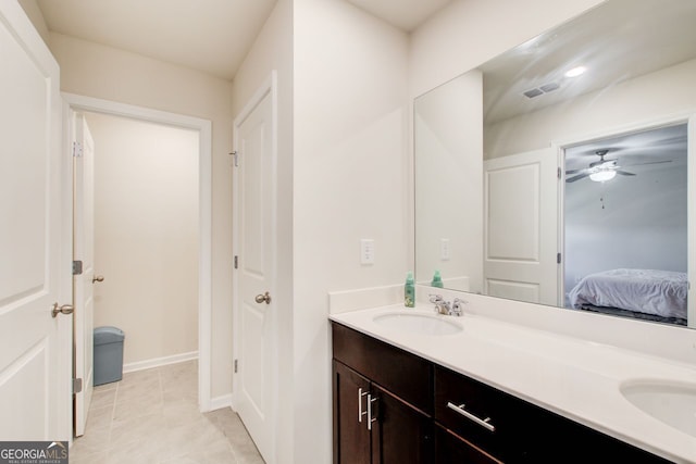 bathroom with ceiling fan, vanity, and tile patterned flooring