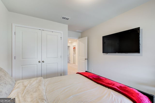 carpeted bedroom featuring a closet