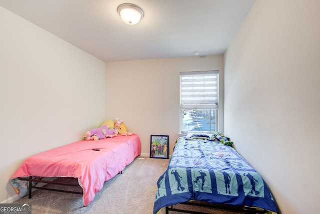 bedroom featuring light carpet