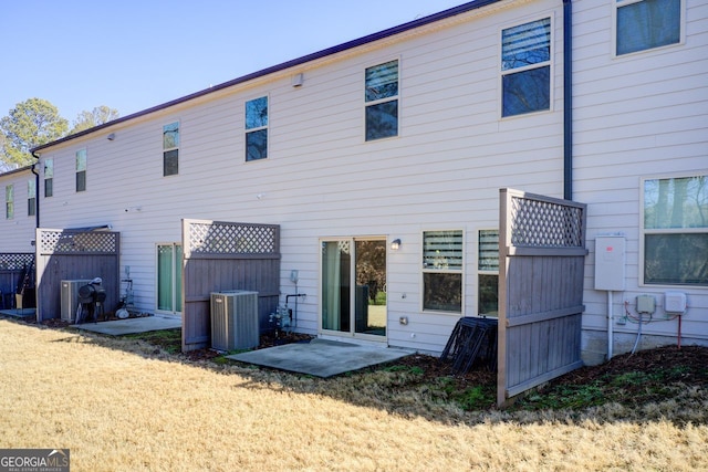 back of property featuring central AC and a patio area