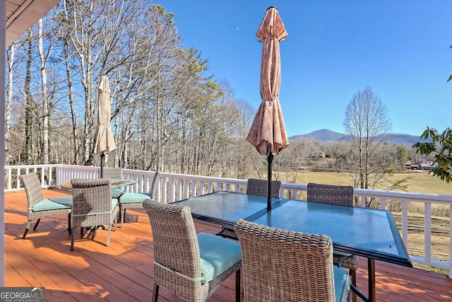 wooden terrace featuring a mountain view