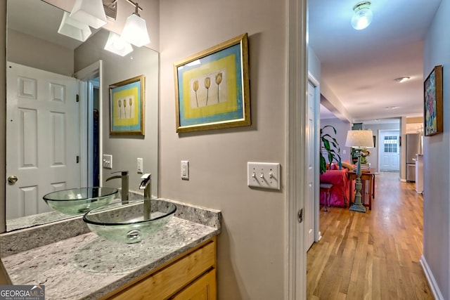 bathroom featuring vanity and wood-type flooring