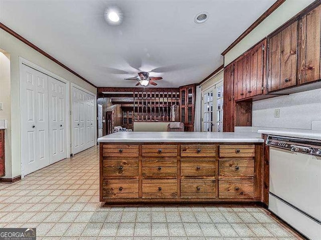 kitchen featuring ornamental molding, ceiling fan, white dishwasher, and kitchen peninsula