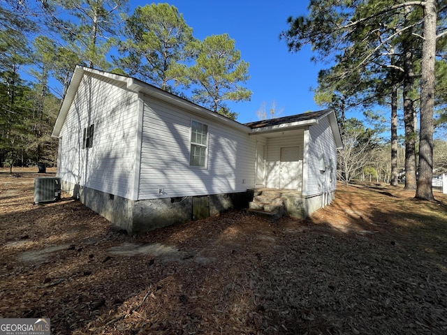 view of side of property featuring central air condition unit