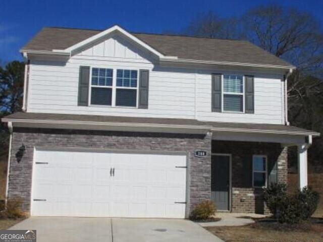 view of front of property with a garage and a porch