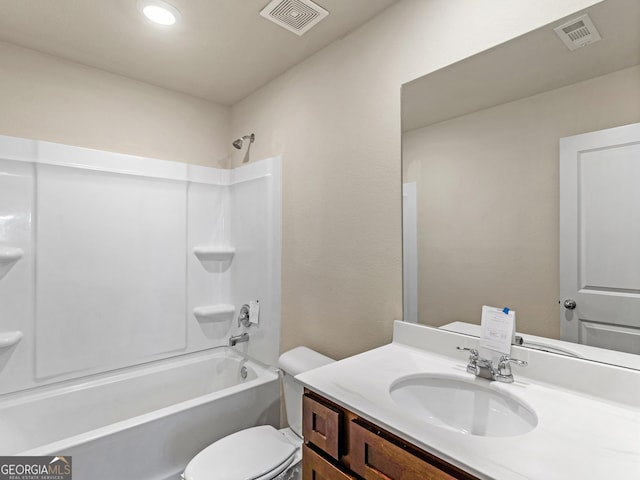 full bath with visible vents, bathing tub / shower combination, toilet, and vanity