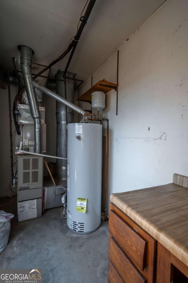 utility room featuring gas water heater and heating unit