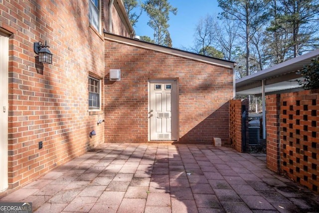 property entrance featuring a patio area