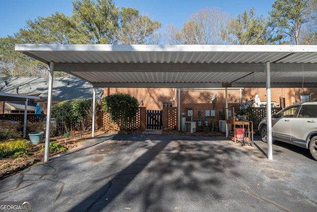 view of vehicle parking featuring a carport