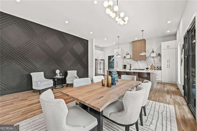 dining space with light wood-type flooring