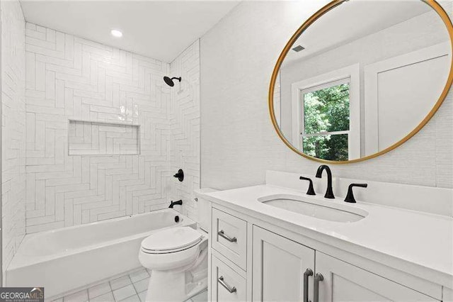 full bathroom with vanity, tile patterned floors, toilet, and tiled shower / bath