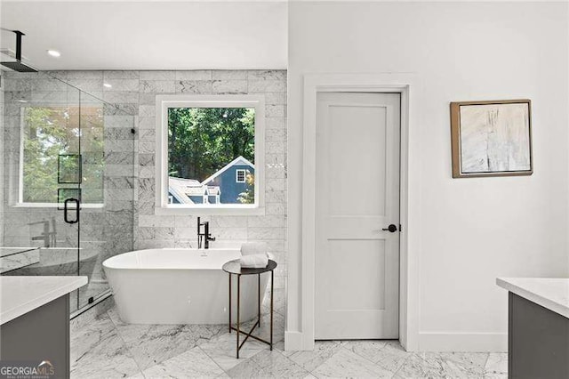 bathroom with vanity, plenty of natural light, and plus walk in shower