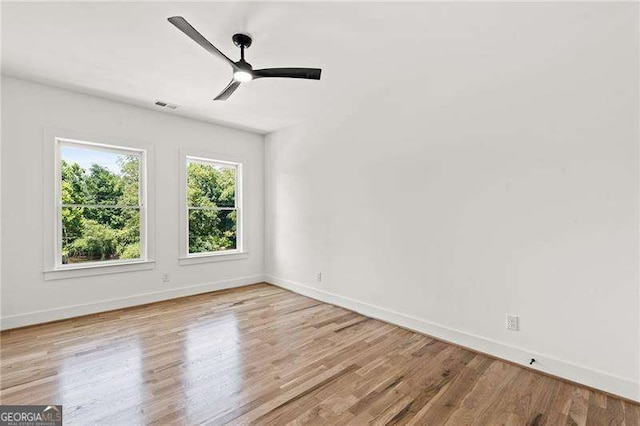 spare room featuring ceiling fan and light wood-type flooring