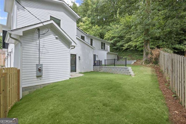 back of property featuring a lawn