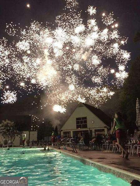 view of pool at night