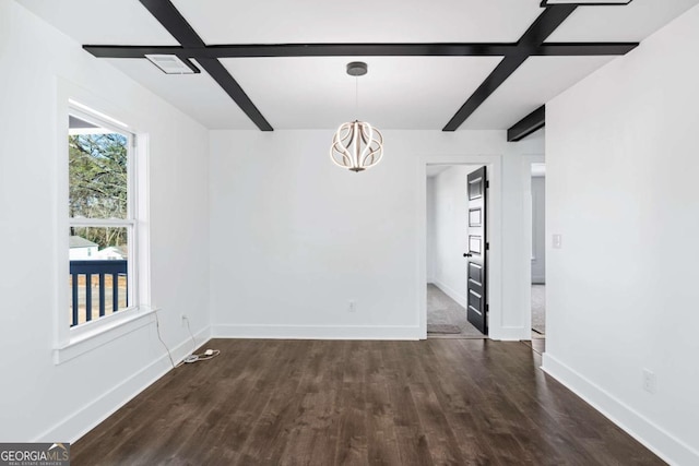 empty room featuring dark hardwood / wood-style floors, beam ceiling, and a chandelier