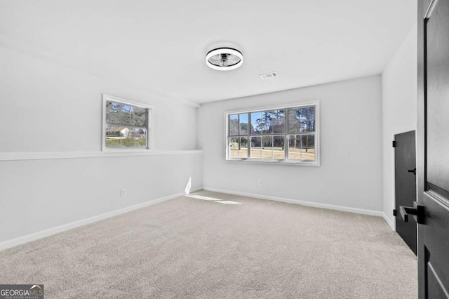 empty room with light colored carpet