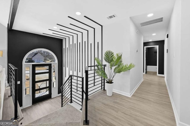 entrance foyer with light hardwood / wood-style floors