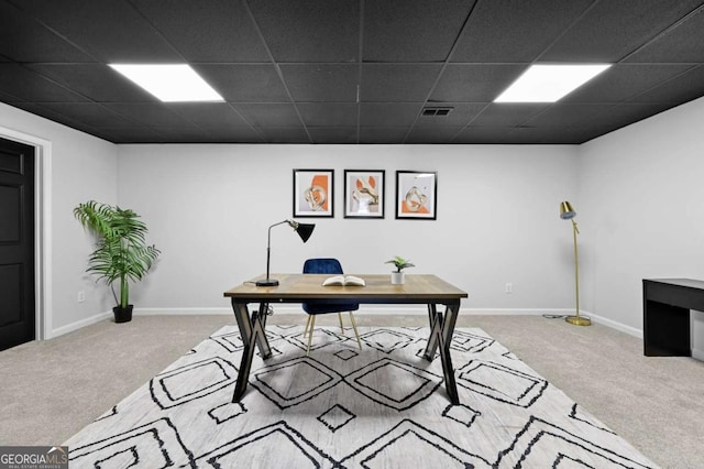 carpeted office space featuring a drop ceiling