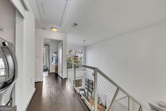 hall with dark wood-type flooring