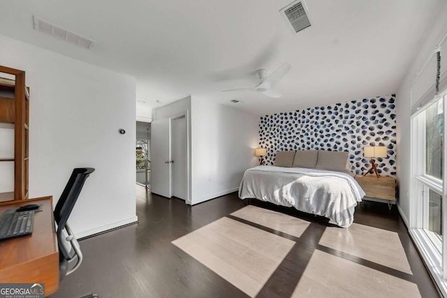 bedroom featuring ceiling fan and dark hardwood / wood-style flooring