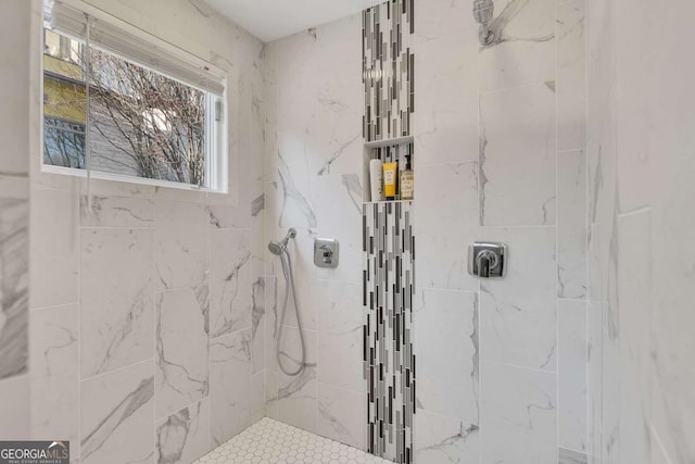 bathroom with a tile shower