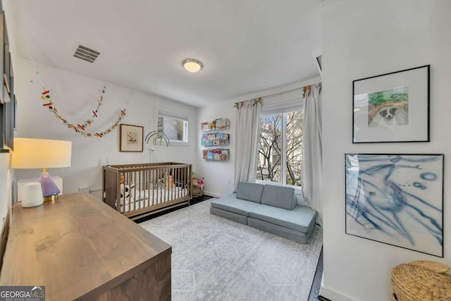 bedroom featuring multiple windows