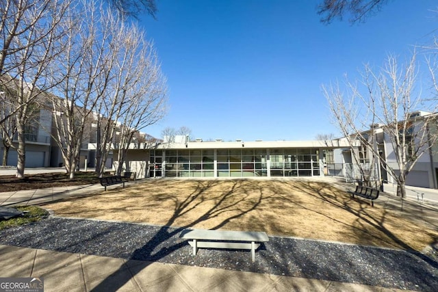 view of front facade featuring a sunroom