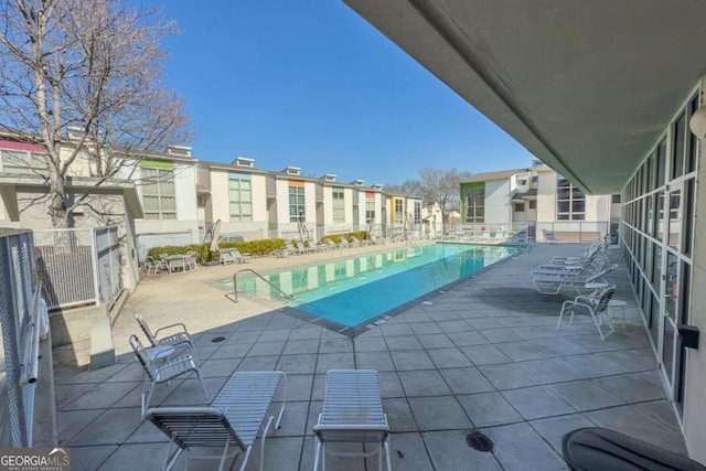 view of swimming pool featuring a patio area