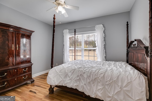 bedroom with ceiling fan and light hardwood / wood-style flooring