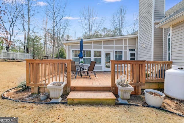 deck with a sunroom