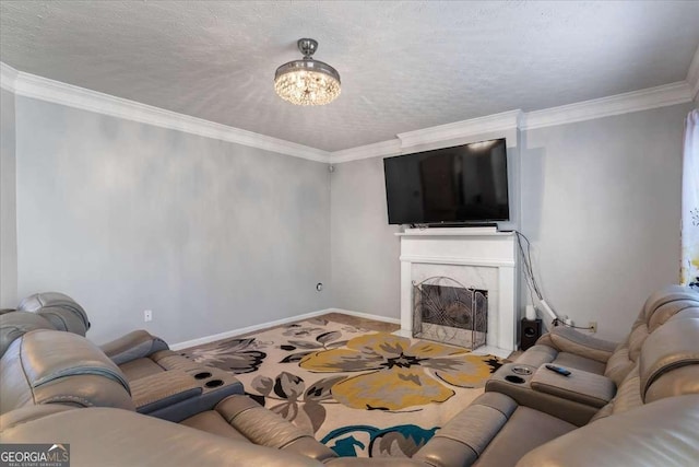 living room featuring ornamental molding, a fireplace, and a textured ceiling