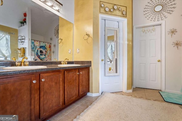 bathroom with tile patterned flooring and vanity