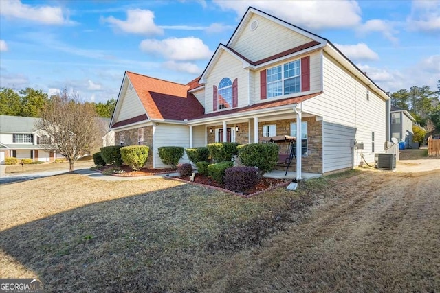 front of property with central AC and covered porch