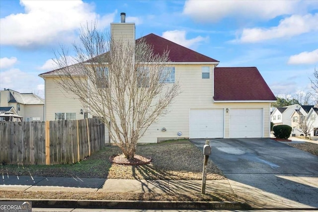 view of side of property with a garage