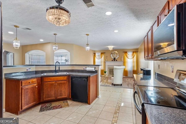 kitchen featuring sink, hanging light fixtures, stainless steel appliances, a healthy amount of sunlight, and light tile patterned flooring