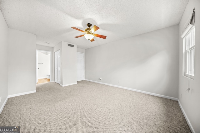 23 Chelsea Ct, Avondale Estates, GA 30002 - unfurnished bedroom with light carpet, a textured ceiling, visible vents, and baseboards