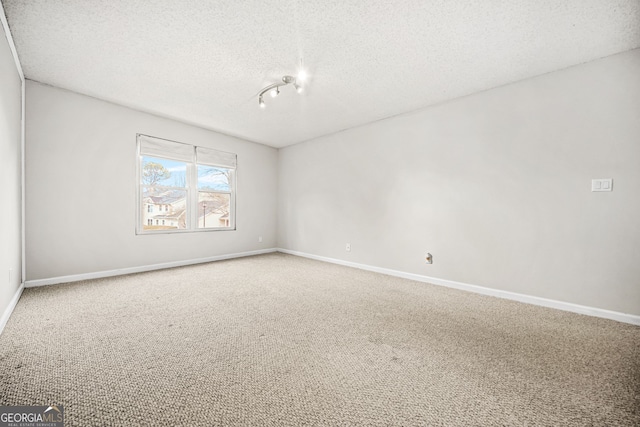23 Chelsea Ct, Avondale Estates, GA 30002 - carpeted spare room featuring baseboards and a textured ceiling