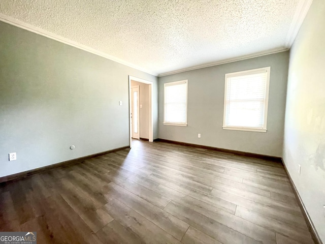 spare room with crown molding, dark hardwood / wood-style floors, and a textured ceiling