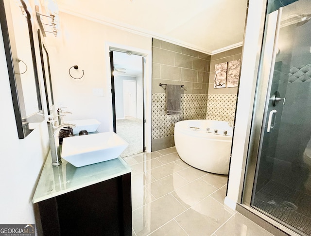 bathroom featuring tile walls, vanity, crown molding, and independent shower and bath